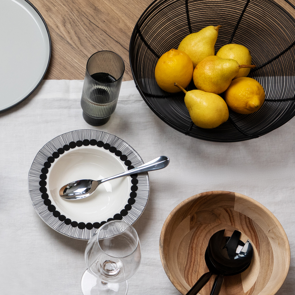 Bread basket with lemons in it 