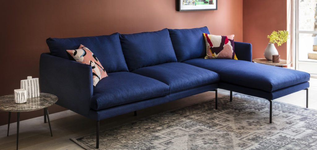Persian Rug with a royal blue sofa
